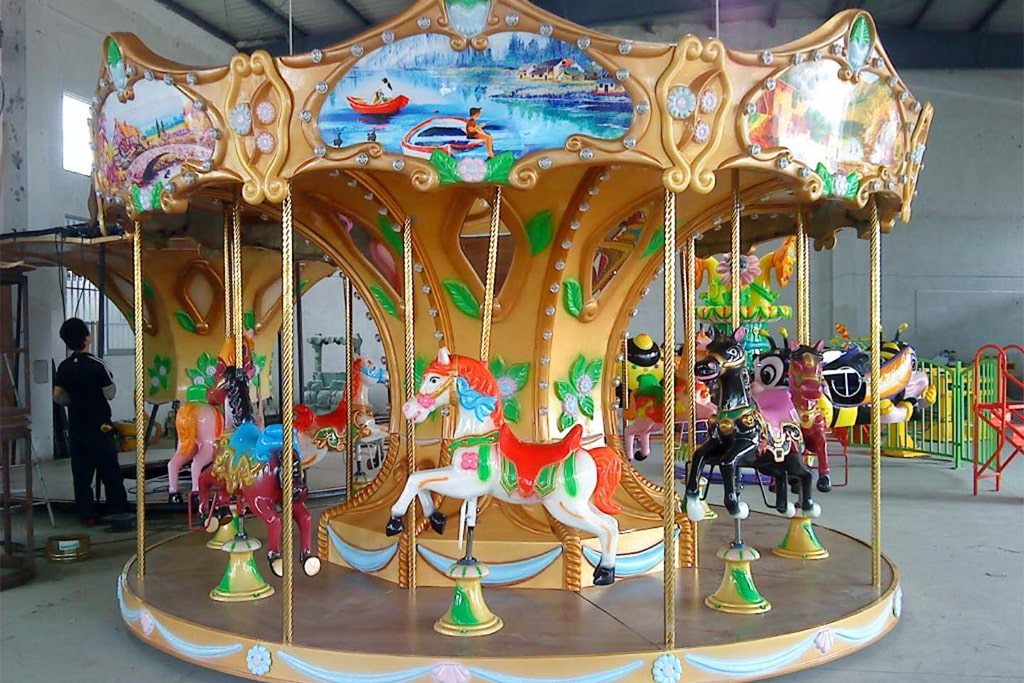 Freshly produced 8 seat mini carousel ride in factory workshop, compact carousel for sale