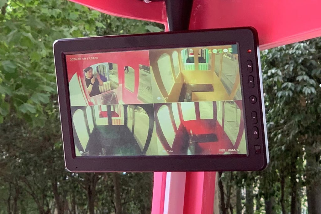 Monitoring screen on mini train rides showing four camera views for safe operation.