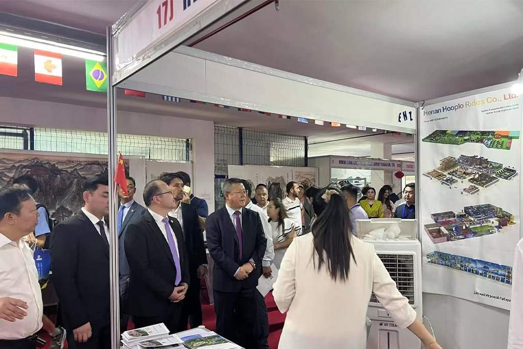 Uzbekistan officials stop by Hooplo Rides booth during the 2025 import and export fair