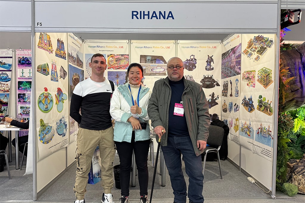 Photo with customer inquiring about coin operated amusement rides at the exhibition