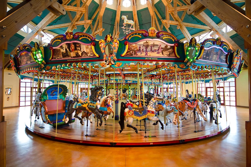 Royal luxury porcelain style carousel horse for sale with glossy finish, pastel colors, and baroque-inspired decorations