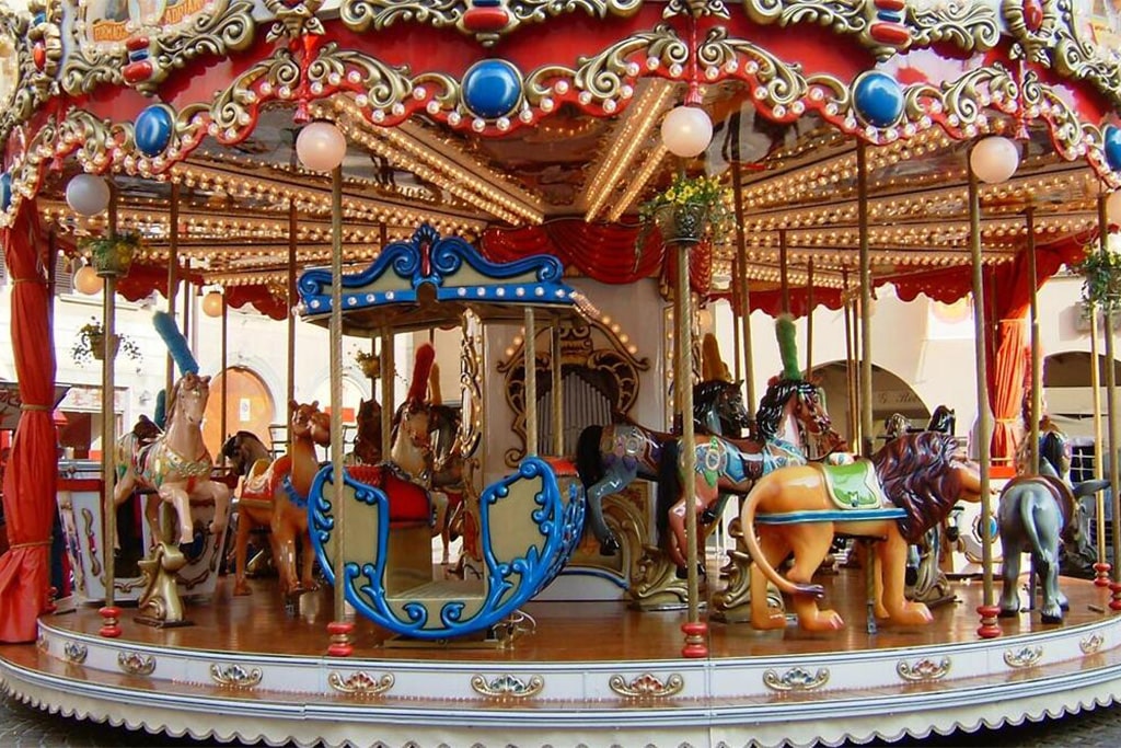 Traditional classic carousel horse for sale with ornate carvings, golden decorations, and vintage amusement ride style