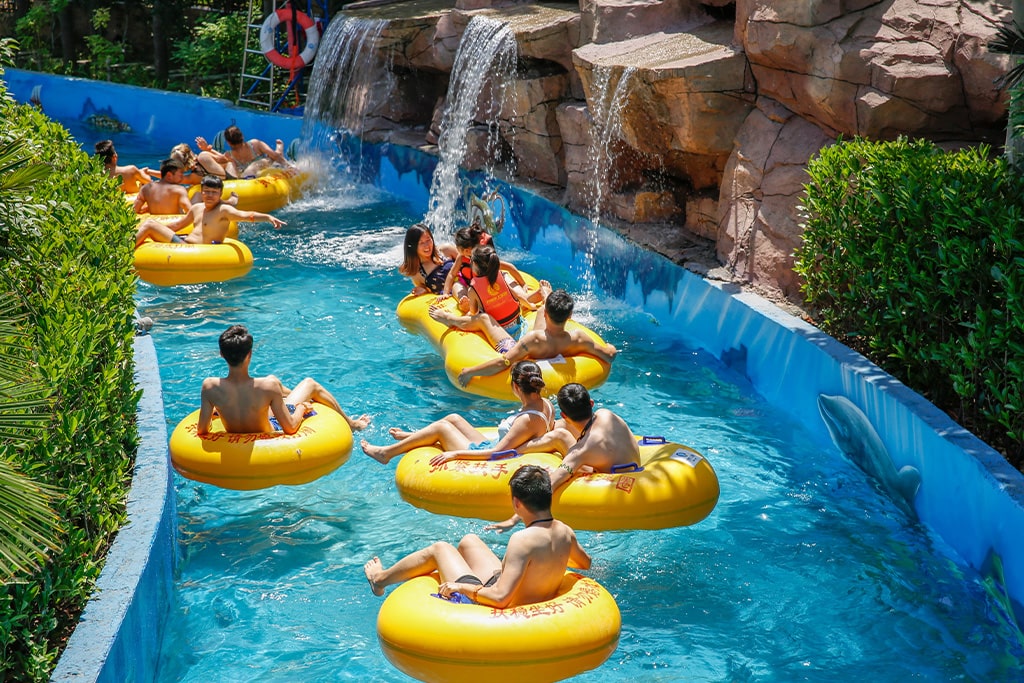 Lazy river attraction with tubes, essential water park equipment for relaxation and family-friendly experiences.