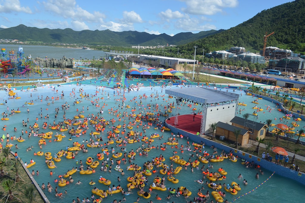 Large wave pool as popular water park equipment, providing exciting surfing and family entertainment.