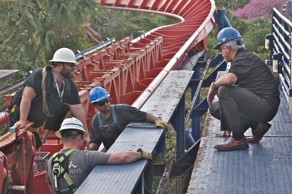 Staff are checking whether the roller coaster track is normal