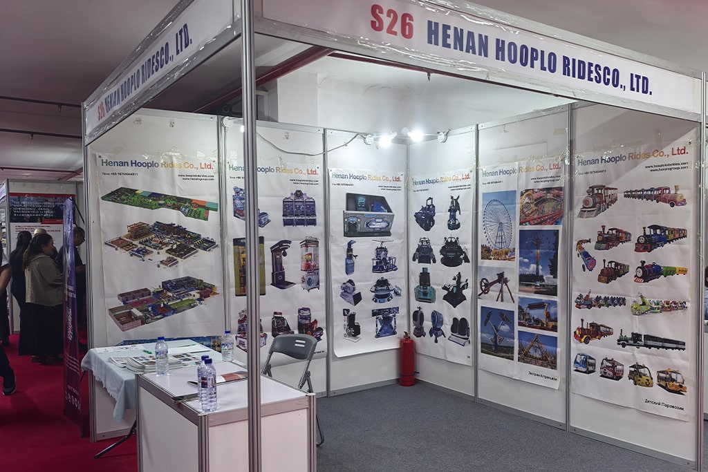 Display of Hooplo Rides amusement ride solutions at the Uzbekistan–China Brand Products Exhibition 2025 booth