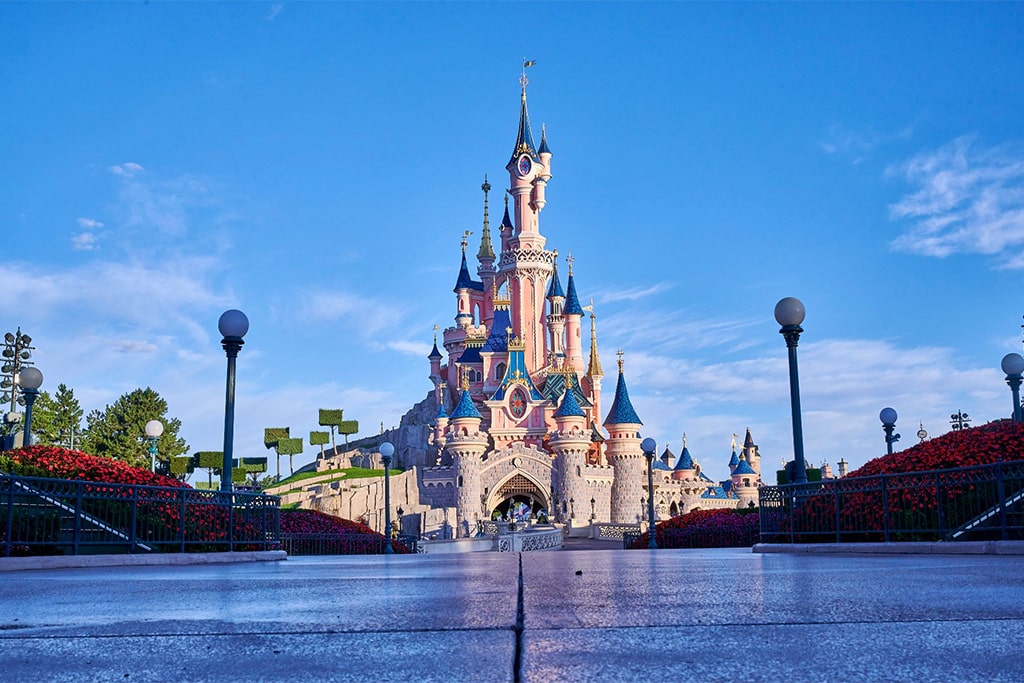 Disneyland Paris with themed lands, iconic castle, rides, and entertainment experiences