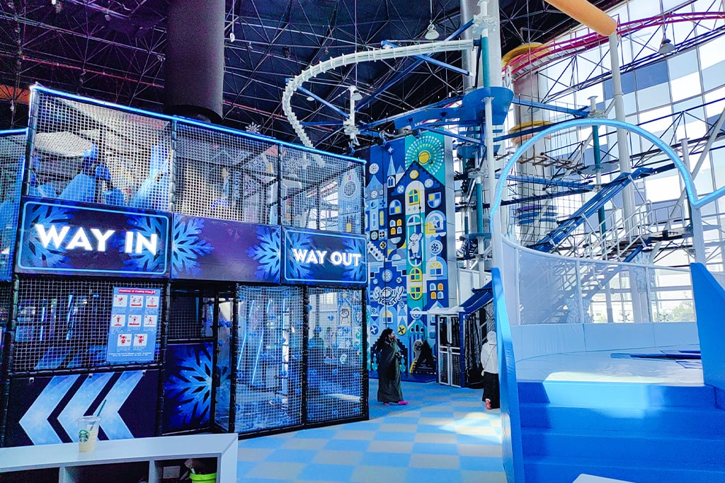A large indoor playground inside a mall, designed for both kids and adults to enjoy.