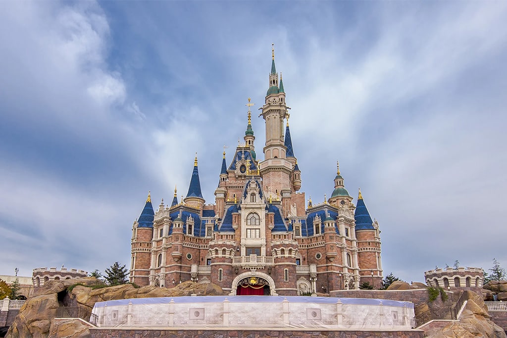 Shanghai Disney Resort aerial view showing themed lands, attractions, and castle landmarks