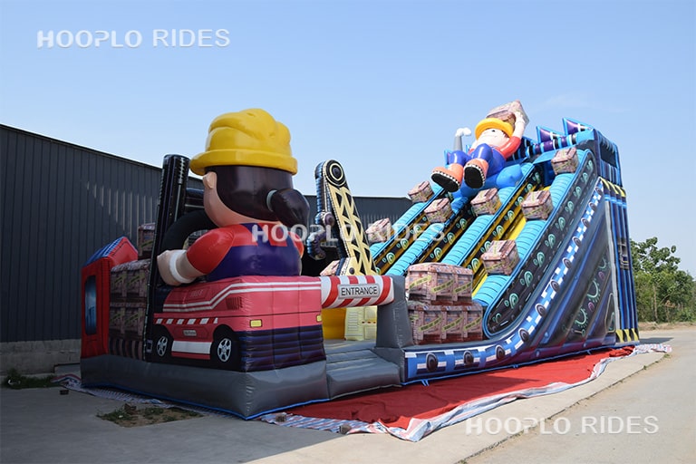 Left side view of the engineer theme inflatable slide showing the slide structure and layout