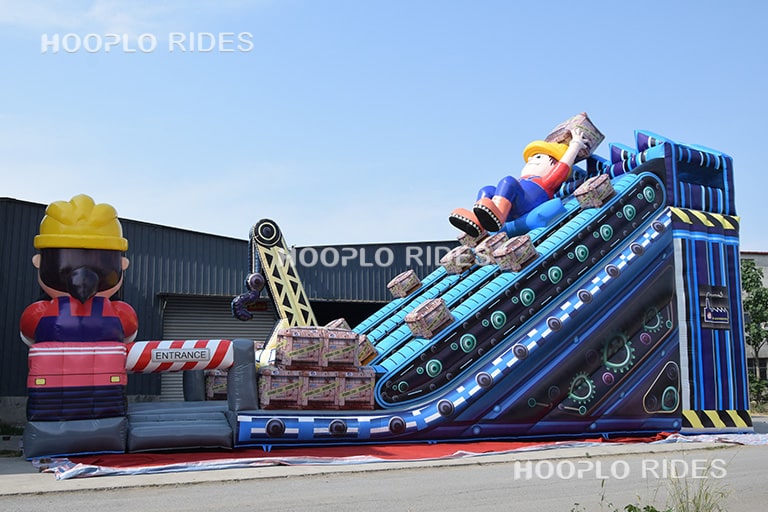 Side view of the engineer theme inflatable slide highlighting the slide height and overall structure