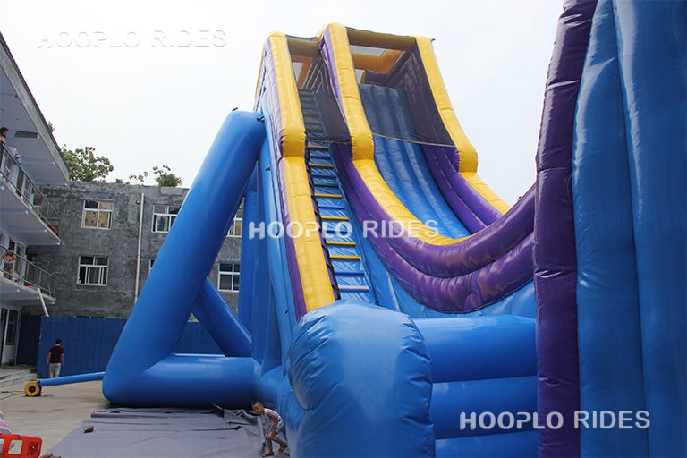 Close-up detail of extreme zero gravity inflatable slide highlighting steep slope and high-speed sliding section