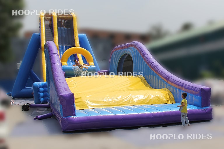 Front view of extreme zero gravity inflatable slide showcasing height and thrilling slide design