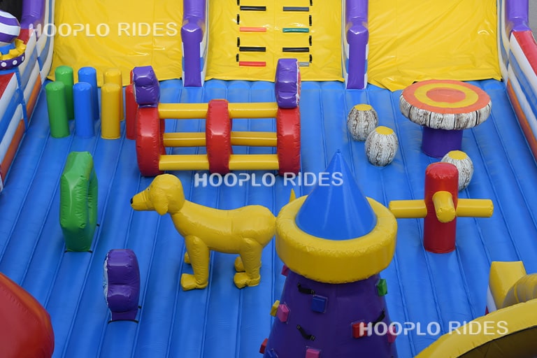 Detailed close-up of the play area inside the Fixies-themed inflatable castle, showing interactive elements and character decorations.