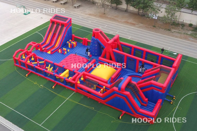 Right side view of the Large Inflatable Obstacle Run highlighting slides, tunnels, and challenge elements.