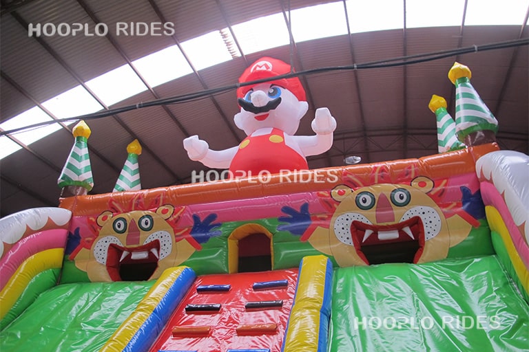 Top character detail of a mario style inflatable slide, featuring a game-inspired cartoon character design