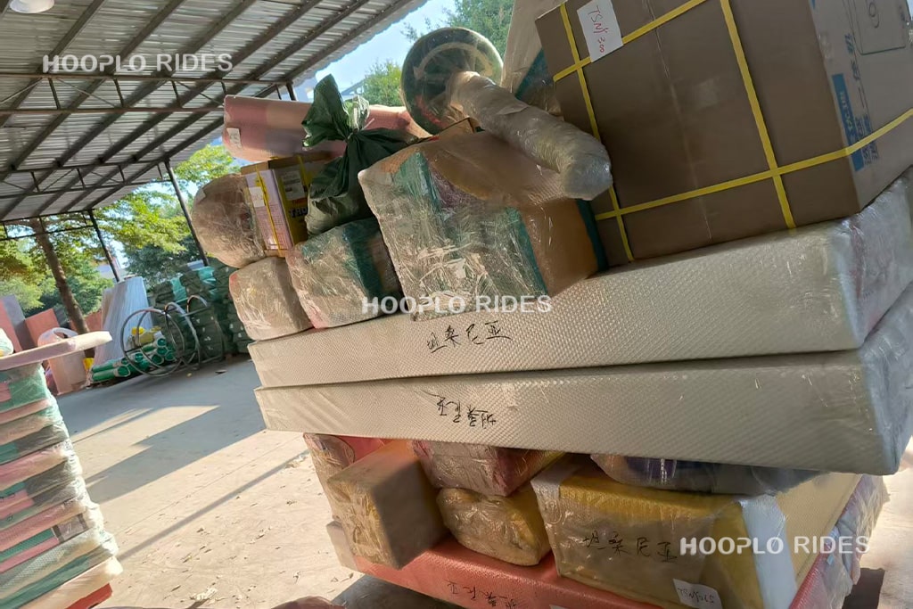 Packed indoor soft play playground components placed in the factory shipping area before loading