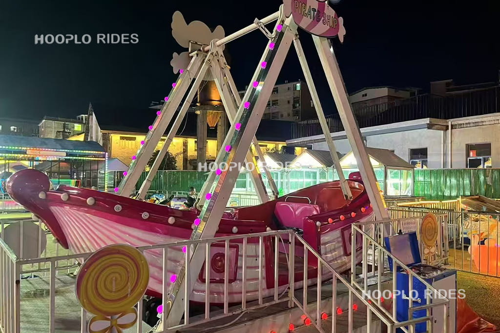 12-seat pirate ship ride installed in a carnival fairground, portable amusement equipment for temporary events