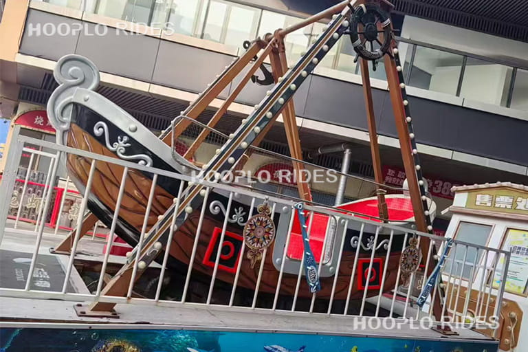 16 seat medium pirate ship ride operating in park, family-friendly thrill ride for medium-size venues