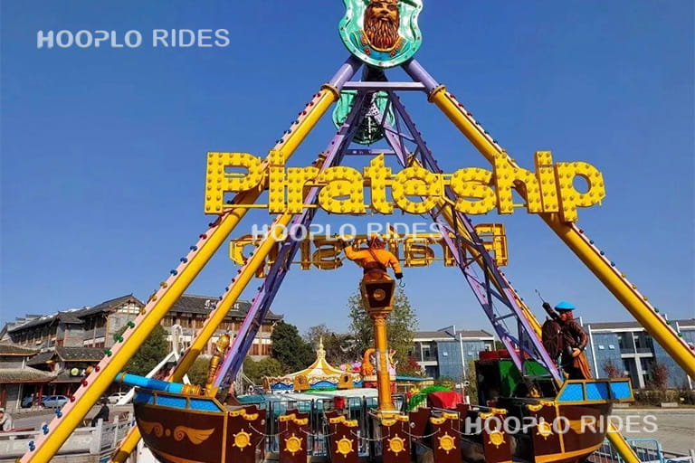 24 seat medium pirate ship ride in amusement park, side view showing steel structure and swing angle