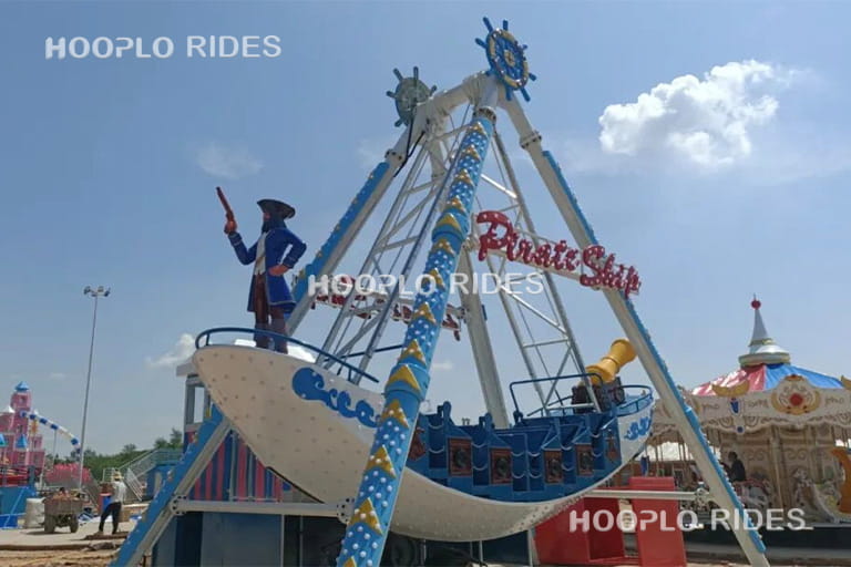24 seat medium pirate ship ride operating in theme park, commercial swinging ride attracting visitors