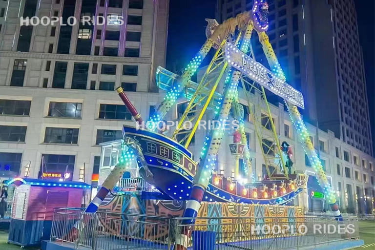 32 seat large pirate ship ride operating in park, family thrill ride with strong visual impact