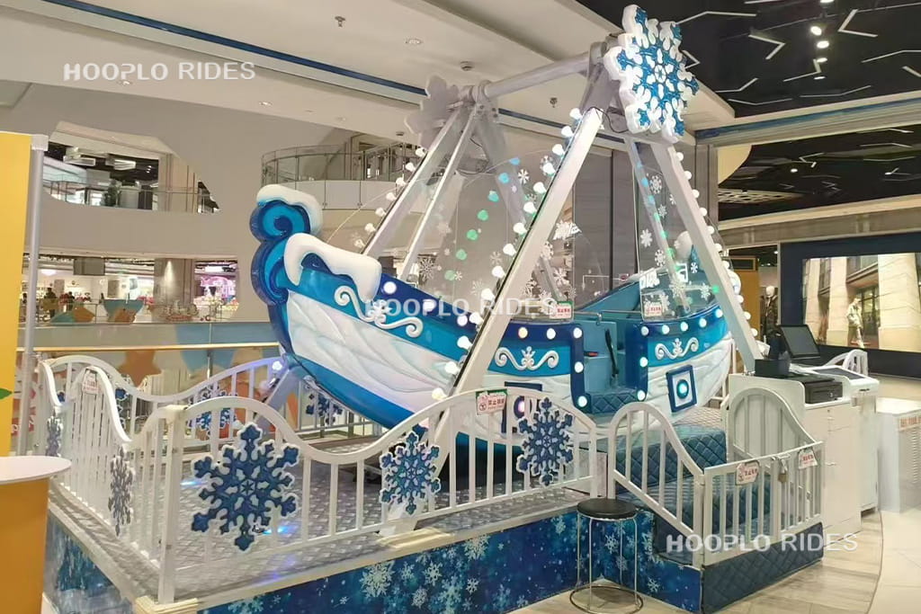 8-seat pirate ship ride operating inside a shopping mall, small portable fairground ride for limited spaces
