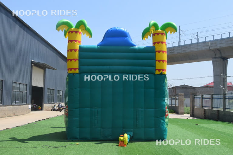 Back view of Animal Paradise inflatable slide displaying air blower connection and rear support structure.