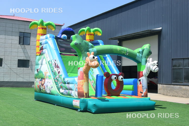 Right side view of Animal Paradise inflatable slide with colorful animal theme design and reinforced PVC structure.