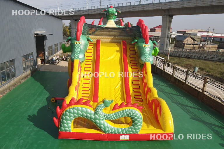 Main image front view of dragon theme inflatable slide inflated in factory, large kids inflatable slide for commercial playground business