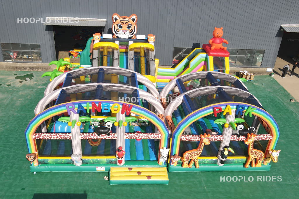 Front view of the original full-size Rainbow Animal Park Inflatable Playground during product testing