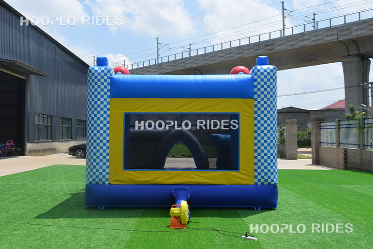 Back view of Pikachu themed inflatable bounce showing structure and air blower position