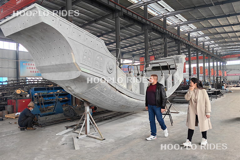 Russian client visiting the pirate ship ride production workshop at an amusement ride manufacturing factory
