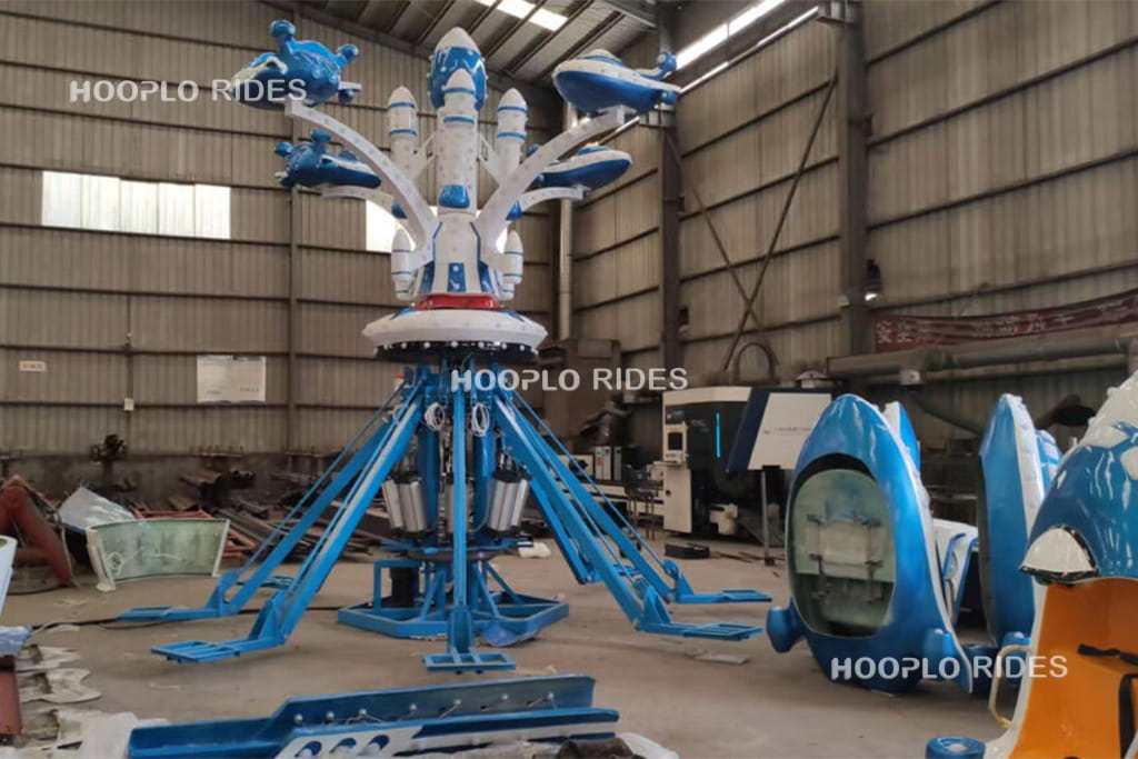 Self-control airplane ride in production and pre-installation testing at amusement equipment factory
