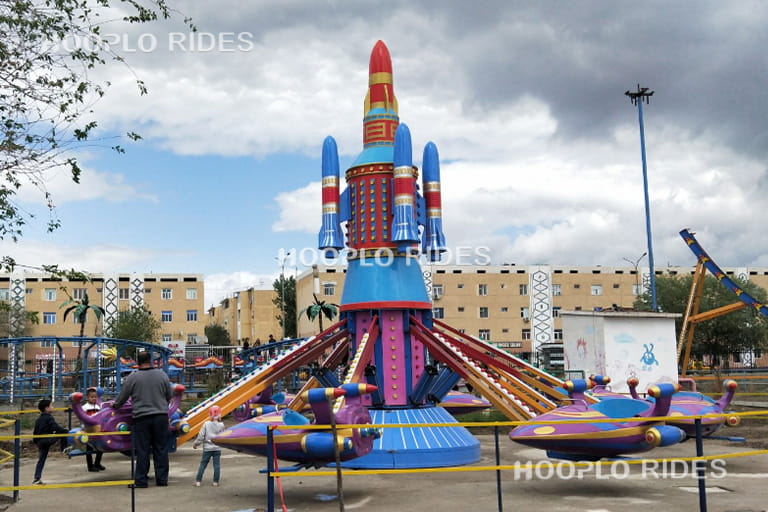 Classic self-control plane ride installed in a customer amusement park in Uzbekistan, operating smoothly for visitors.