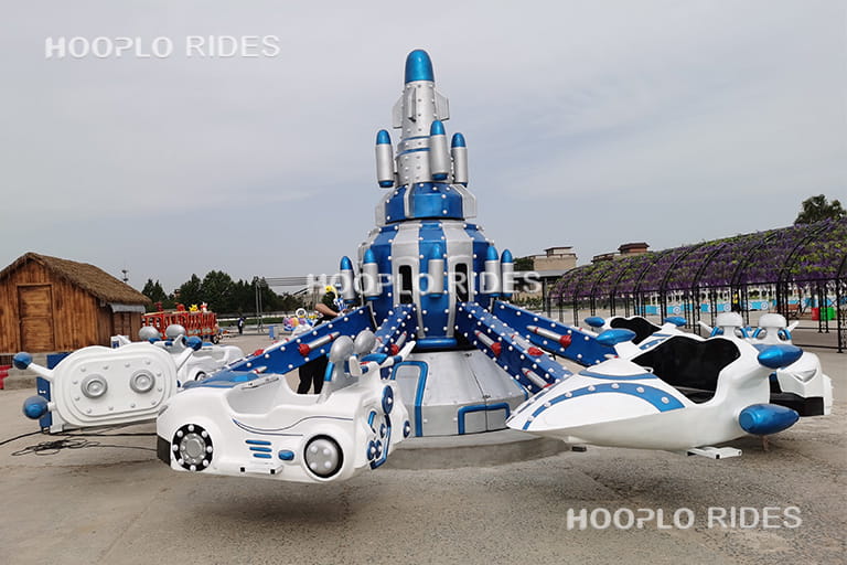 Upgraded self-control plane ride with interstellar flight theme design, featuring futuristic space-style cabins and vibrant colors.