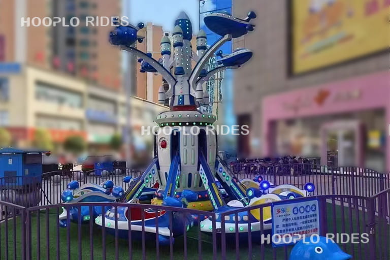 Upgraded self-control plane ride with rocket-themed cabins, creating an exciting outer space adventure experience.