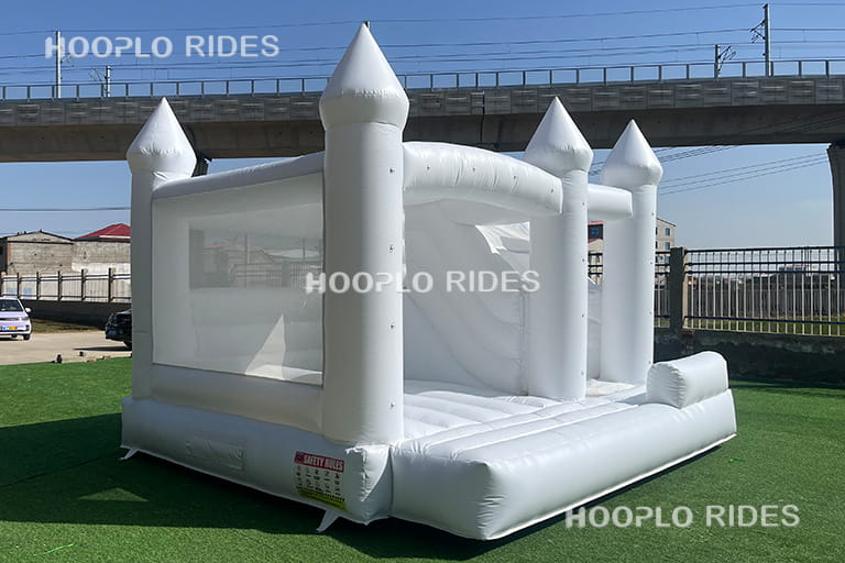 Right side view of white wedding inflatable bounce house with clean minimalist design suitable for wedding decoration themes.