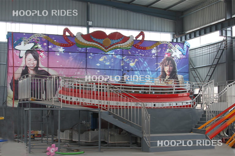 36 seat Large Disco Tagada Ride assembled in the factory and ready for testing, large spinning and bouncing amusement ride before delivery