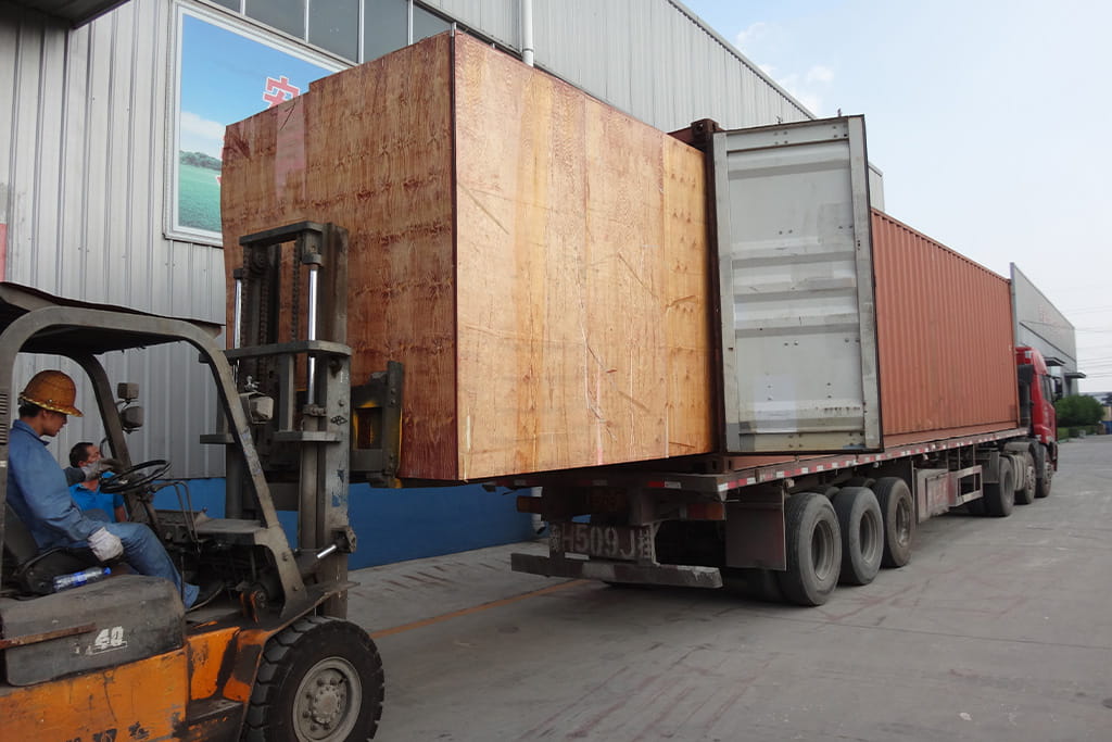 Wooden crates containing packed amusement ride components prepared for container loading before international shipping