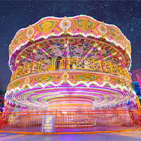Carousel merry-go-round operating in an amusement park
