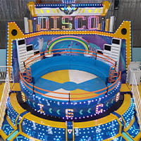 Disco Tagada ride spinning attraction operating in an amusement park
