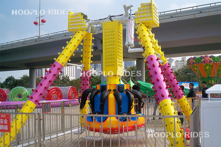 6-seat mini pendulum ride operating at a roadside amusement business area, compact pendulum ride suitable for small parks and plazas