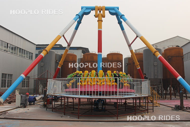 Fully assembled pendulum ride installed in the factory testing area ready for operation test