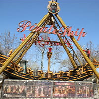 Pirate ship amusement ride swinging in an amusement park