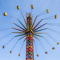 Swing tower ride operating in an amusement park